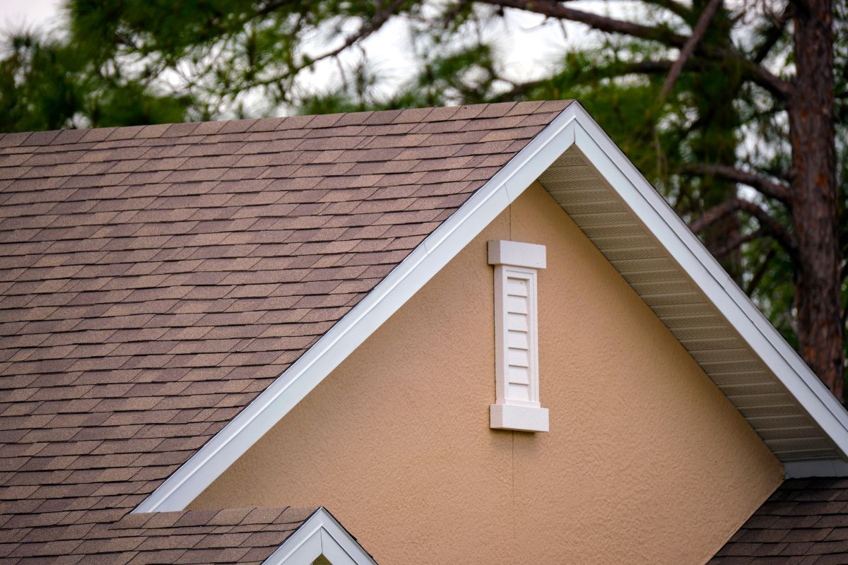 Close-up of house roof top covered with asphalt shingles on a Woodbury house