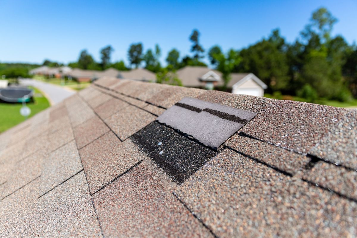 A missing shingle after storm damage in Woodbury