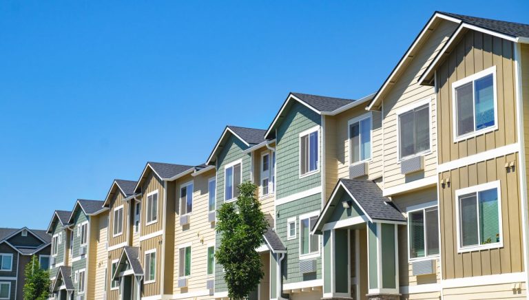 Colorful apartments in Woodbury with shingle roof
