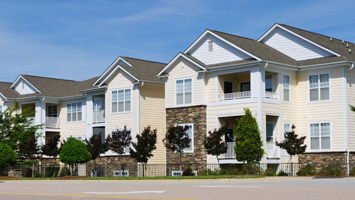 White apartments with shingle roofs, in Woodbury
